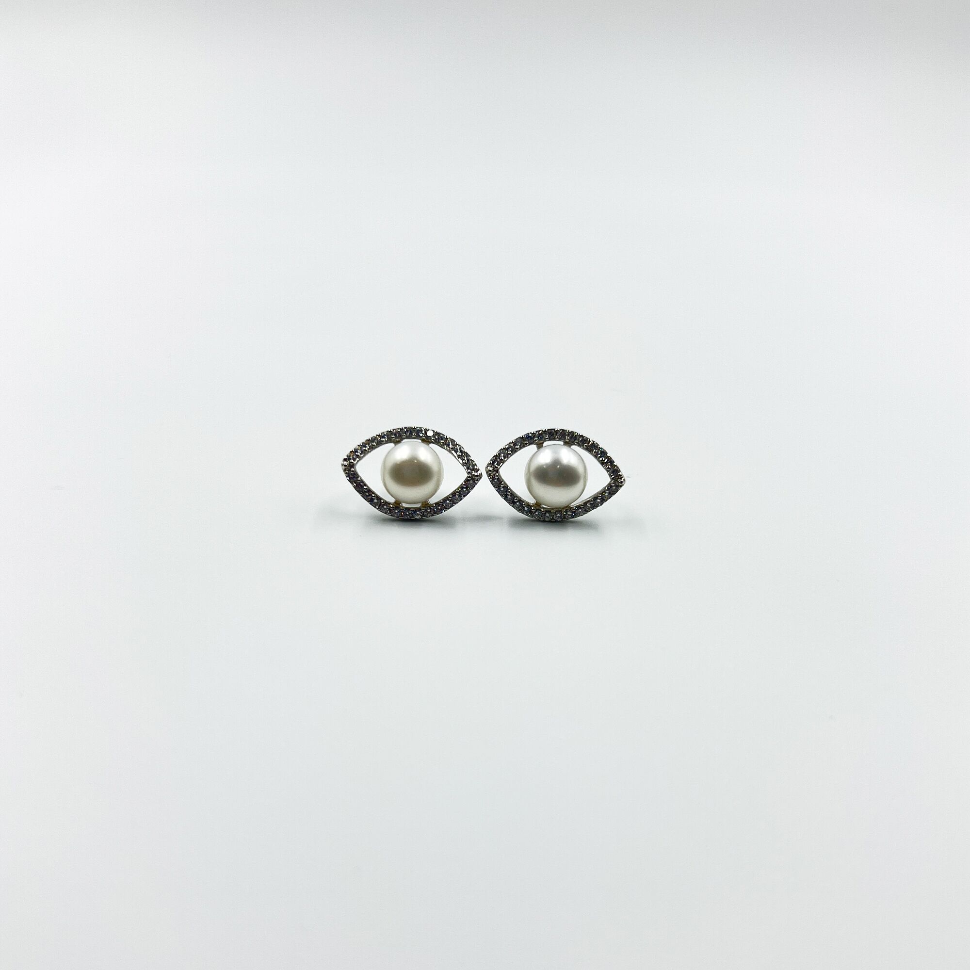13 An evil eye pearl studs from ekatvajewls