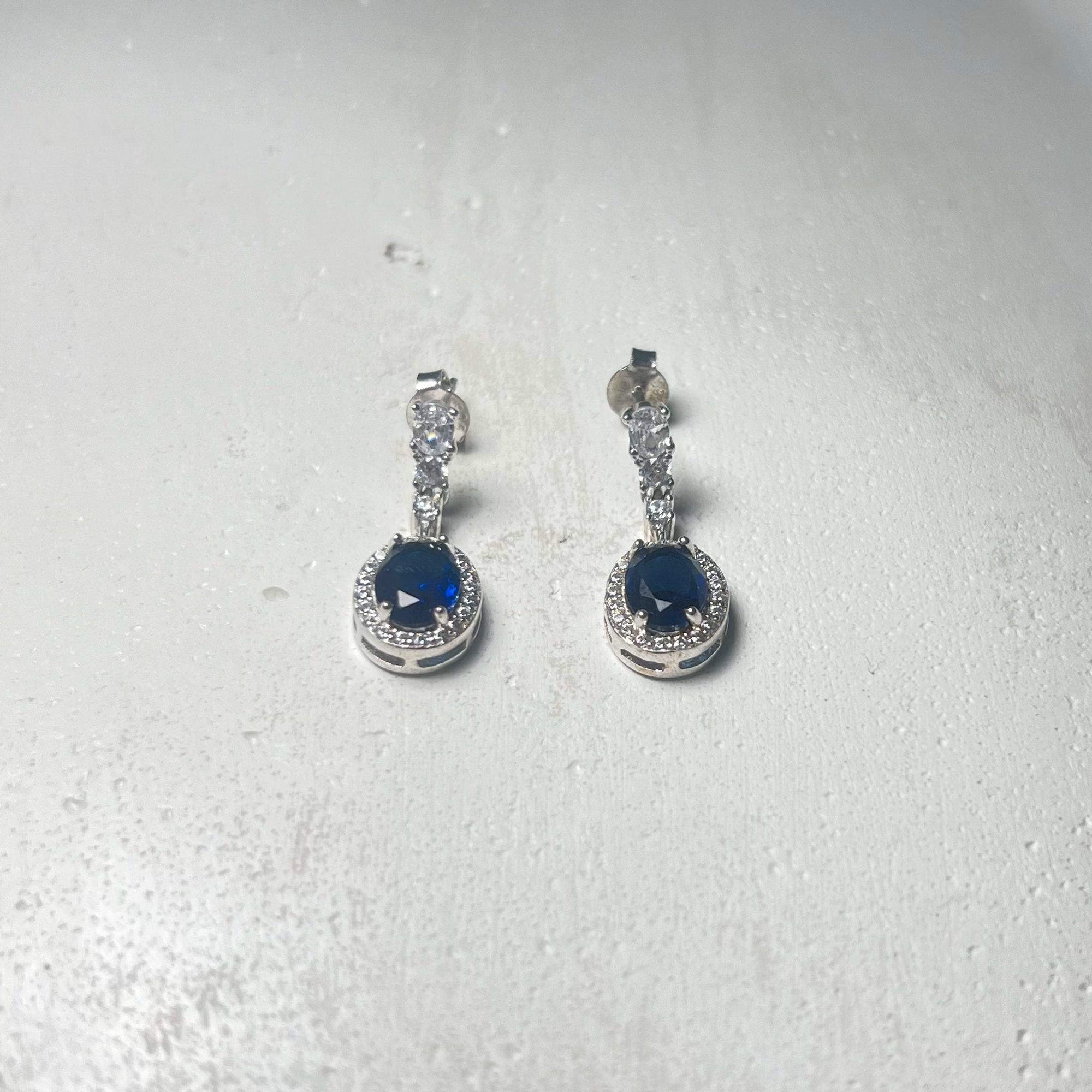 Blue Star Dangling Earrings from ekatvajewels